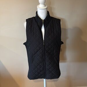 Brand new vest with tags. Front zipper. 2 pockets.